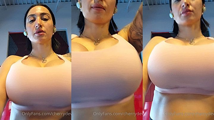 naughty damsel Cherry Devivre show of her big bouncy titties upclose