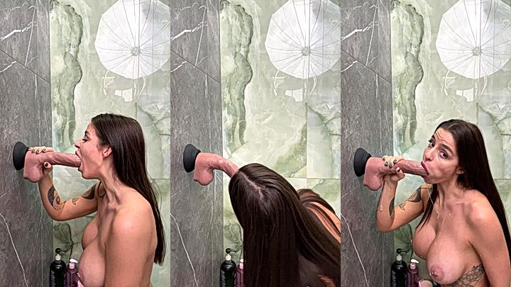 Sonya Jess sticked a huge dildo on the wall to suck it really hard like its a real cock