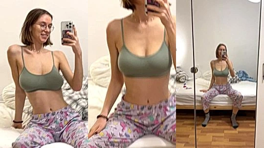 russian onlyfans model Yourina do mirror selfie seating on a bed